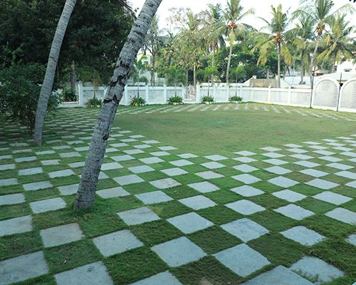 Large lawn surrounded with trees and greenery making it ideal outdoor wedding halls in chennai
