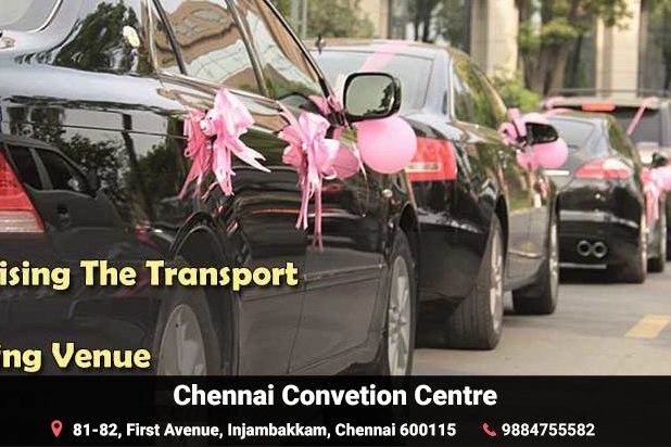 Pink ribbon decorated black Cars parked in a line at the wedding venue