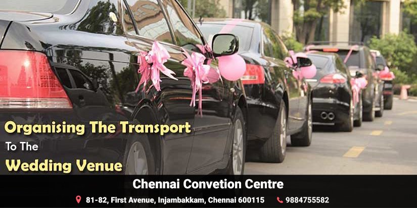 Pink ribbon decorated black Cars parked in a line at the wedding venue