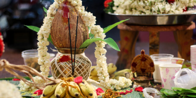 A decorated kalash, pooja items and flower garlands are kept ready for the Kanagabishegam or Navathi celebration.