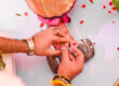 A Tamil wedding Groom wearing Toe ring or metti or minchi to the bride a tamil wedding ritual.
