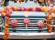 A car decorated with flowers is ready for Janavasam.
